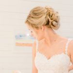 Textured chignon wedding and bridal hair and classic makeup