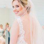 This bride has a textured chignon updo hair style with classic glamour makeup done onsite by Tammie Garza in Austin, Texas.