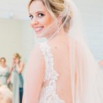 Textured chignon wedding and bridal hair and classic makeup