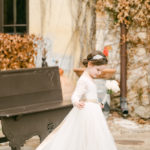 Bridal onsite stylist Austin, Texas flowergirl braided bun with flowers